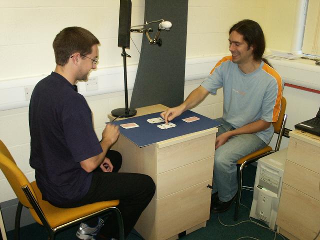 Image of two humans playing a game from which to learn